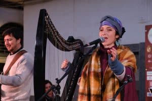 a woman singing into a microphone