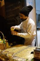 a man pouring liquid into a glass